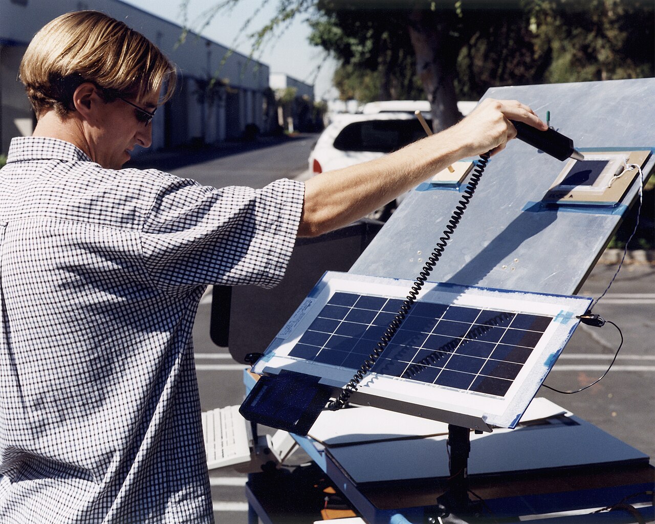 A technician at AeroVironment's Design Development Center in Simi Valley, California, checks a panel of silicon solar c…