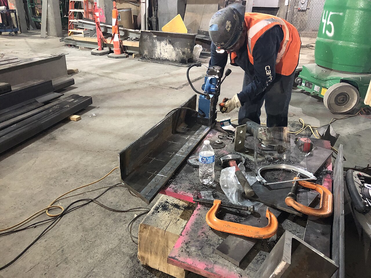 Ironworkers fabricating structural steel for the architectural framing by 47th Street in the future LIRR passenger conc…